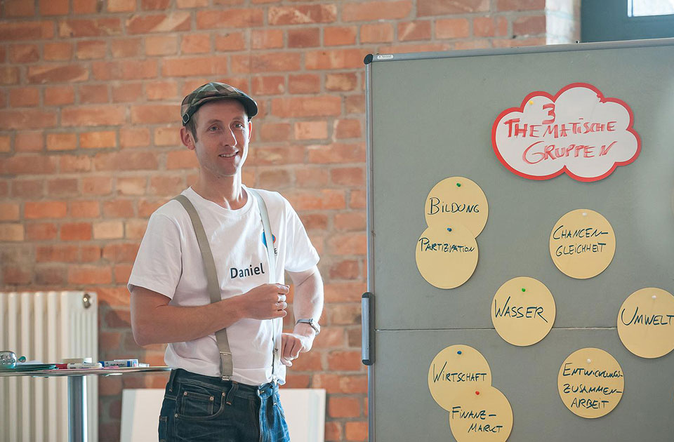 A participant in front of the blackboard.